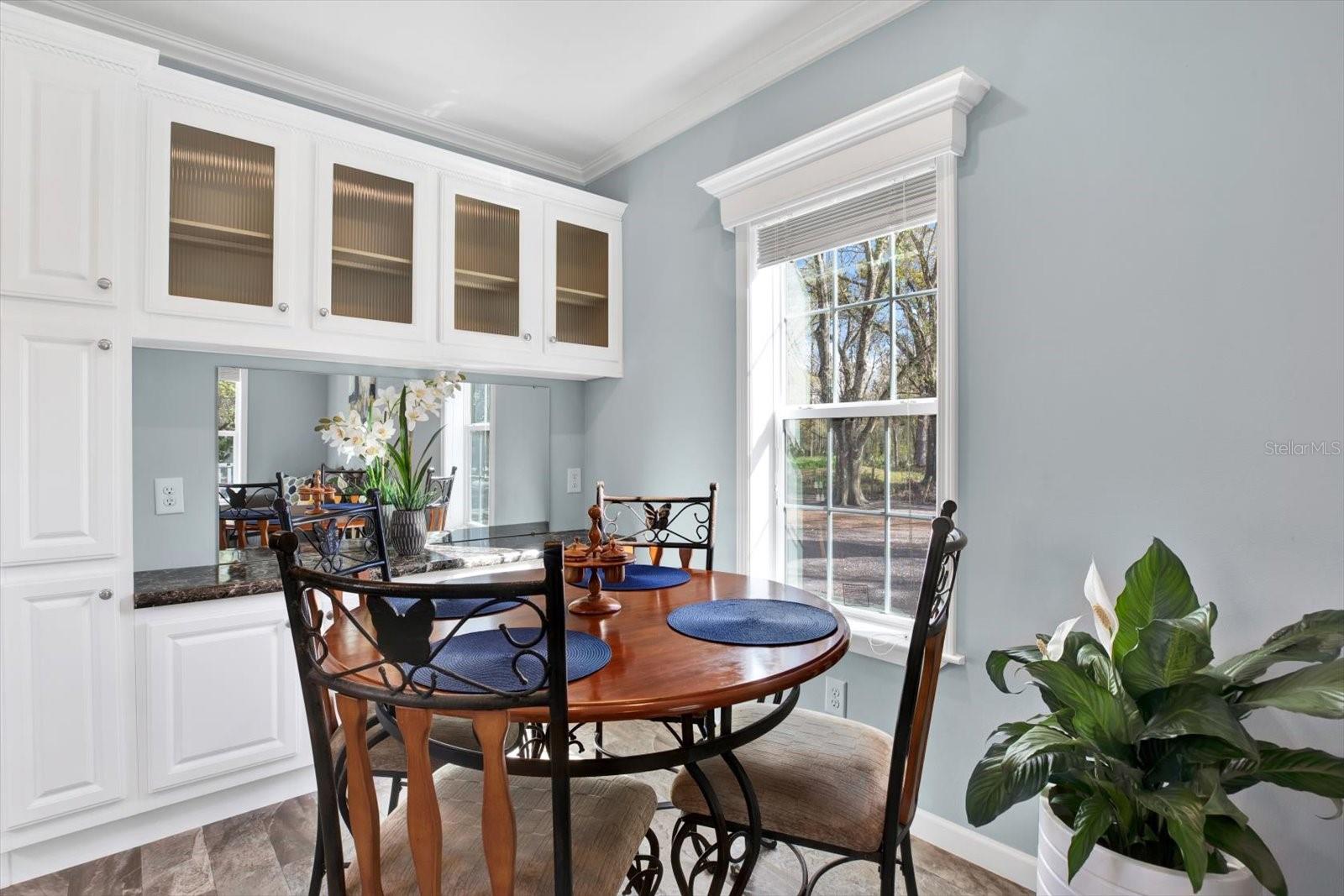 Dining area with extra storage cabinets.