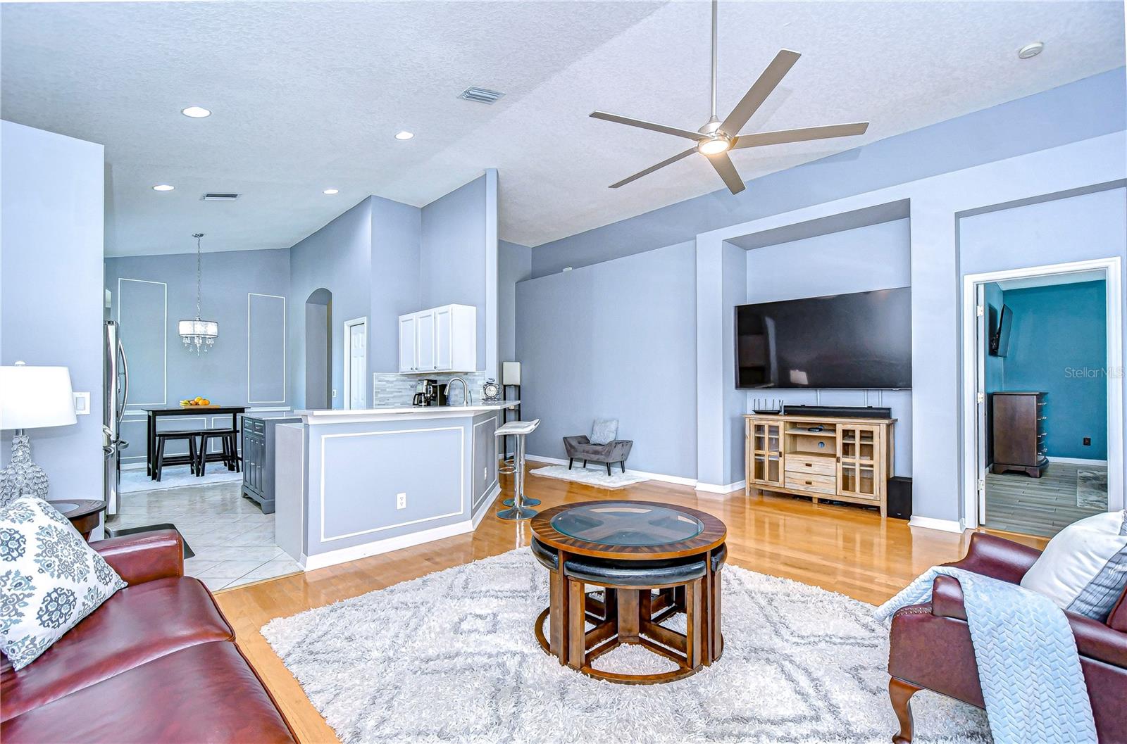 This stylish living area features sleek design, elegant lighting, and a cozy vibe.