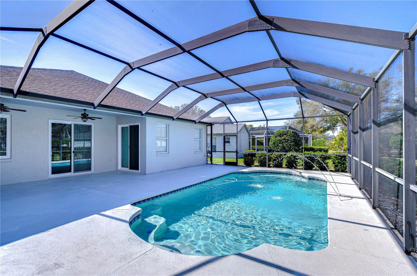 This stunning pool area offers privacy and tranquility.