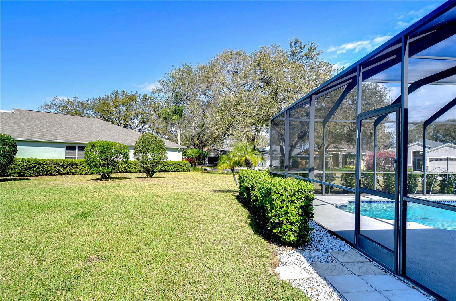 Discover serenity in this spacious backyard.