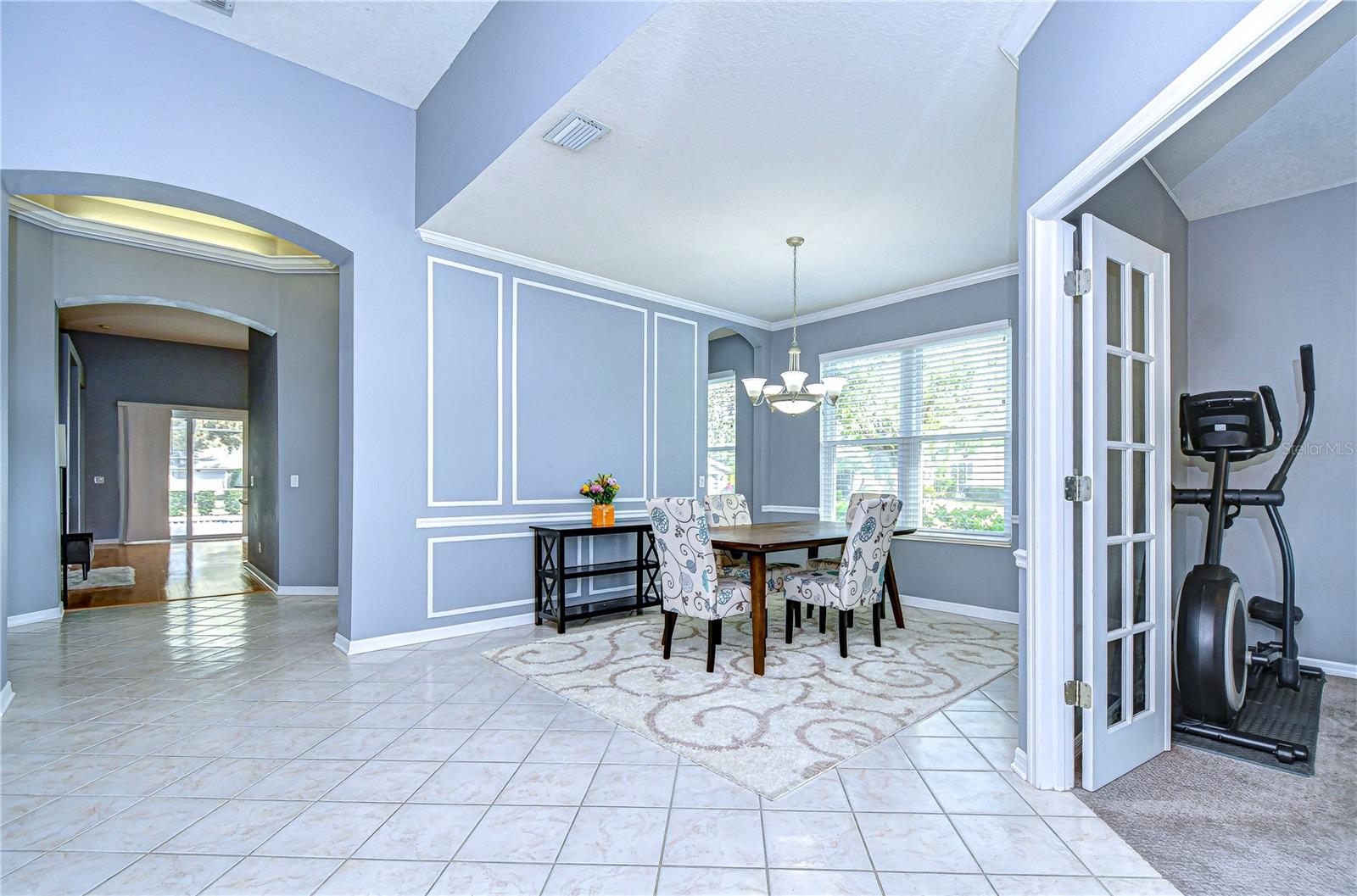 Discover refined living in this elegant dining space, bathed in natural light.