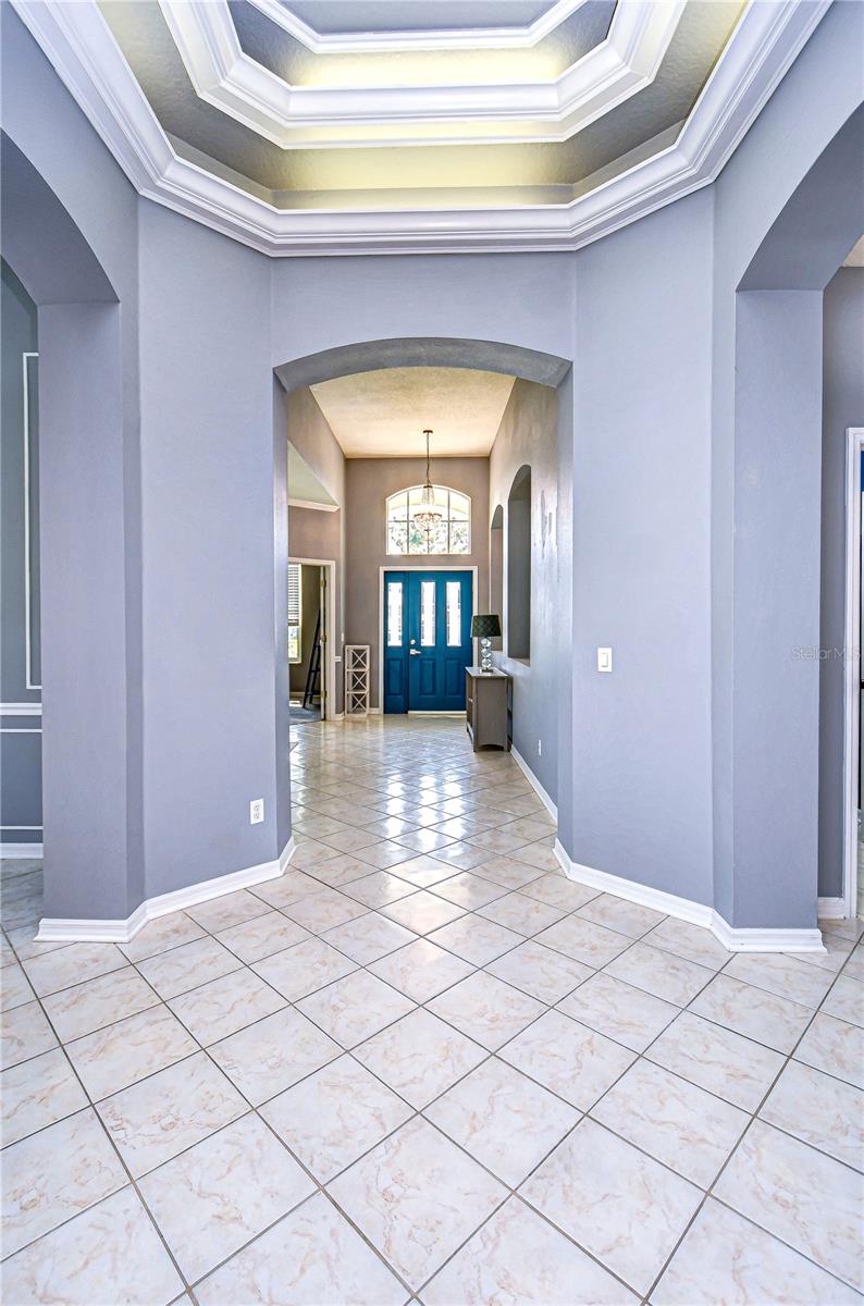 Grand entryway, highlighted by stunning tray ceilings.