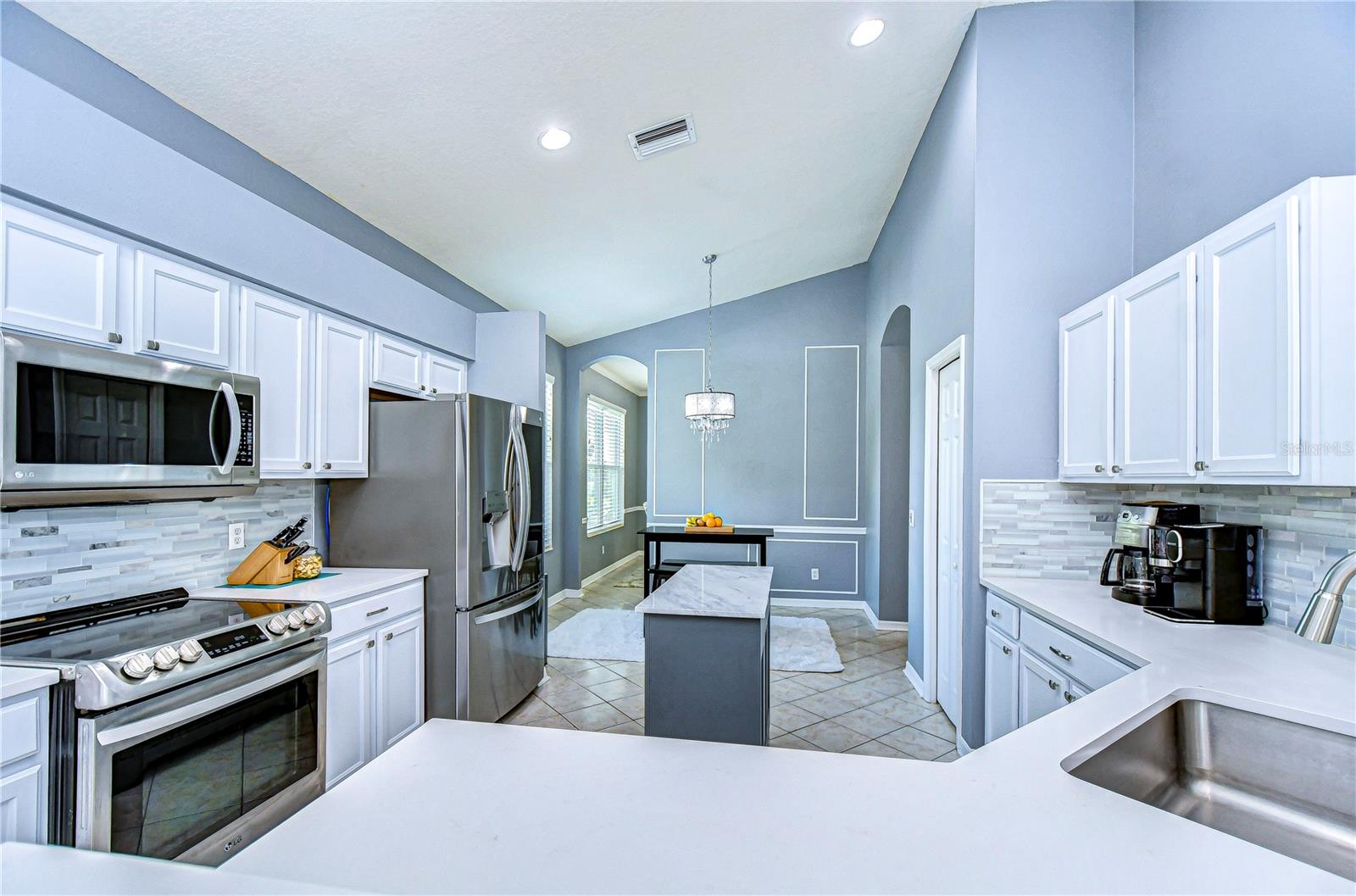 Step into culinary elegance with this pristine kitchen!