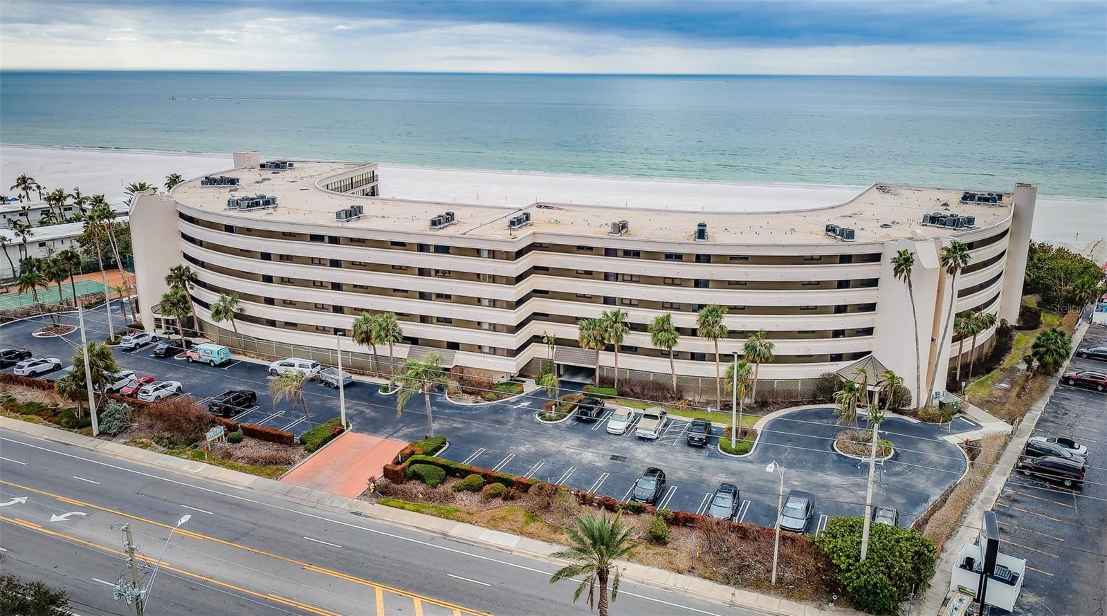 Aerial of The Lldo.  All units have under building parking; note the abundant extra parking in front of the building.