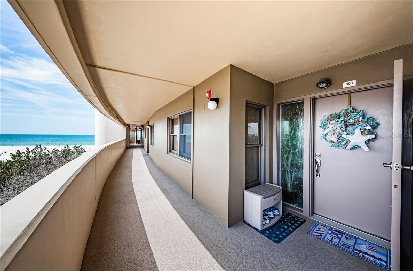 Walkway and entry door to unit 303