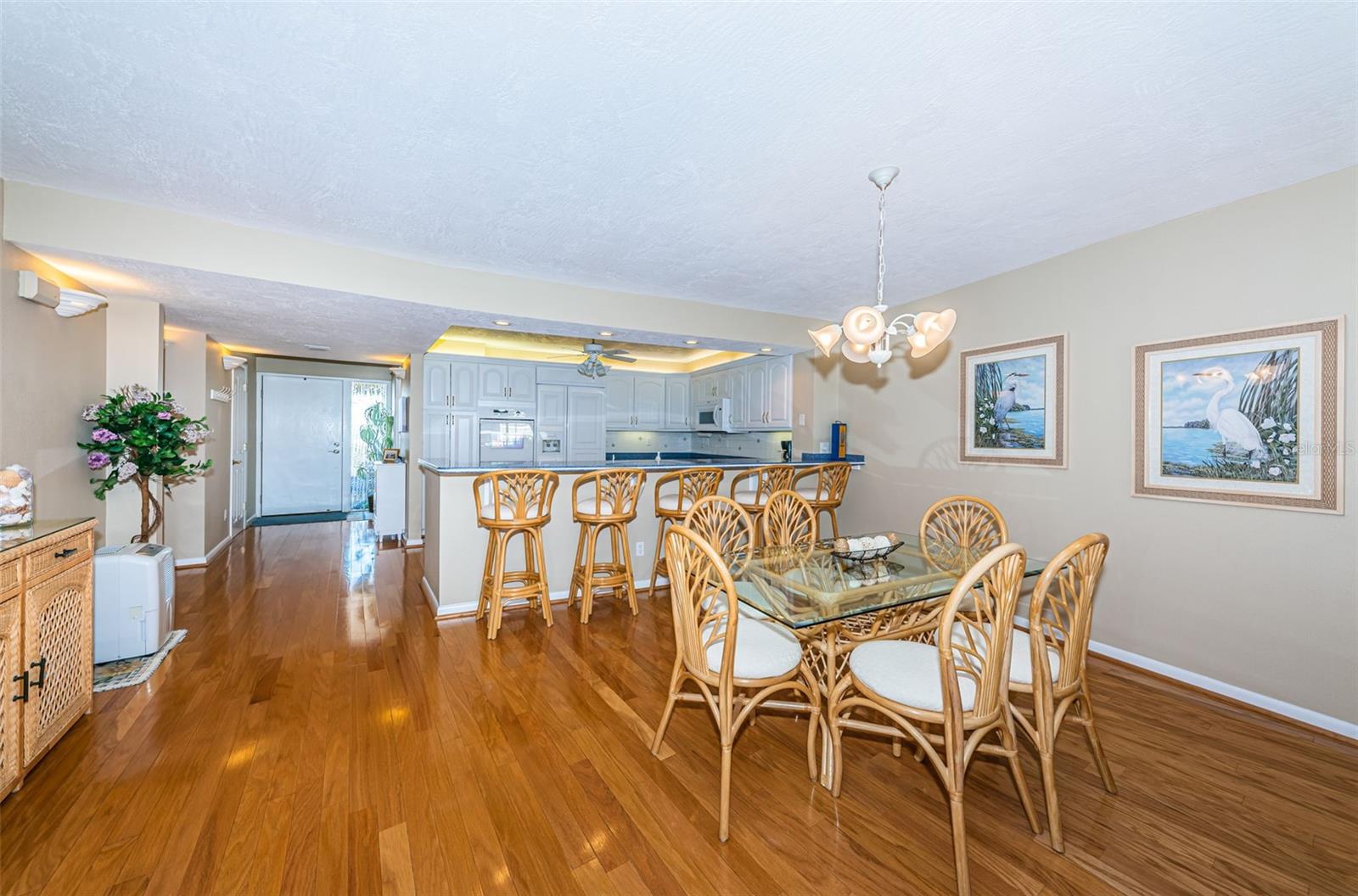 Dining area has a breakfast bar and plenty of room for a larger table if desired