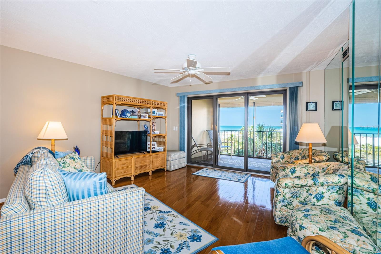 Living area with gleaming engineered hardwood floors.