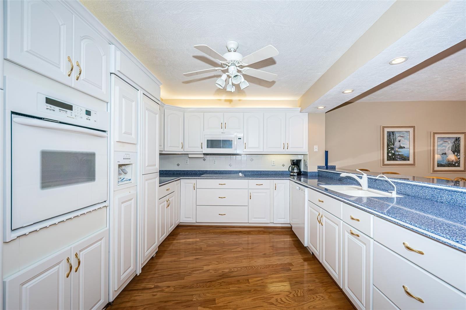 Light and bright kitchen with plenty of cabinetry and prep space