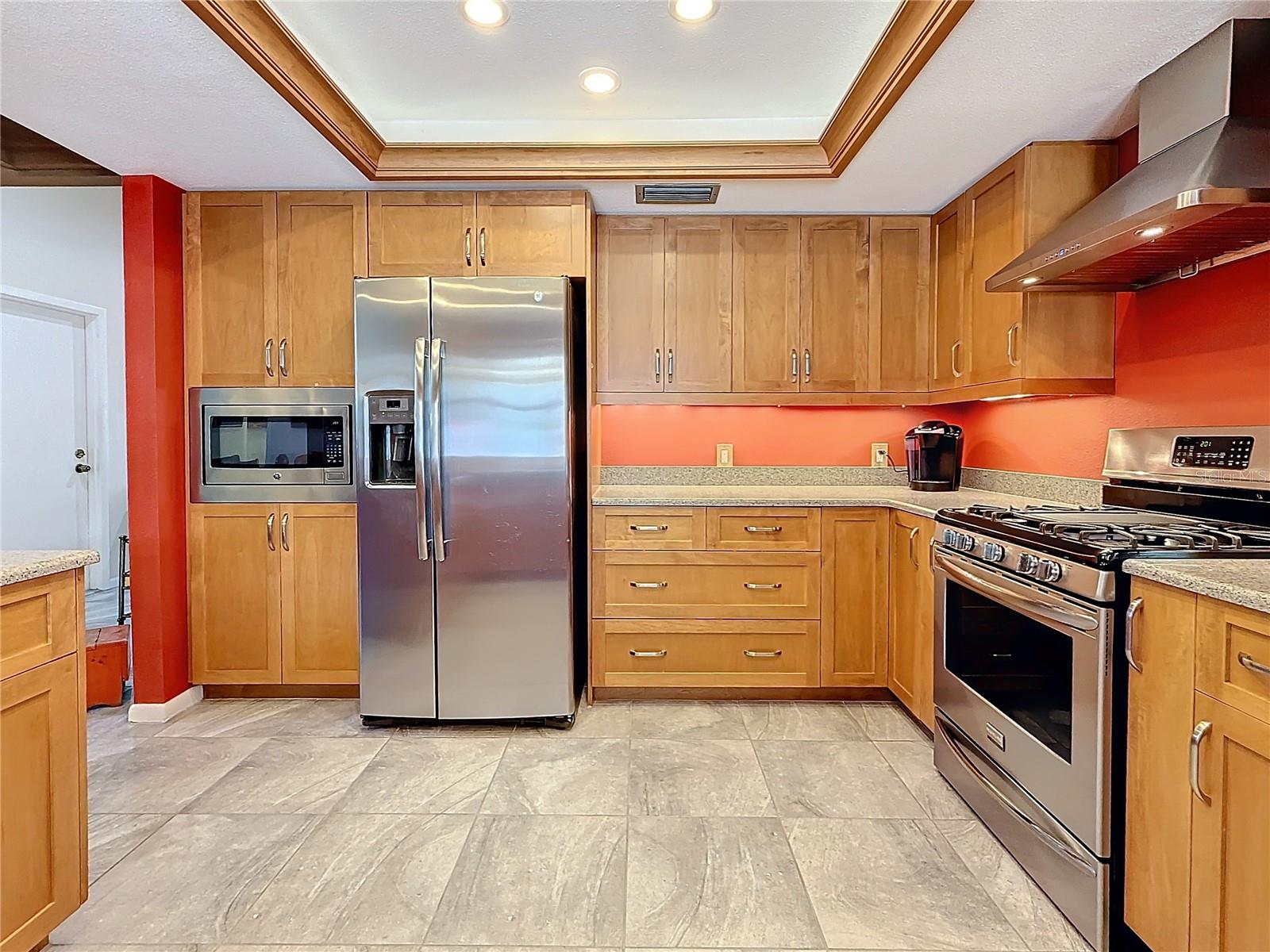 Gorgeous wood cabinets, stone counters, updated stainless steel appliances and a built in Microwave