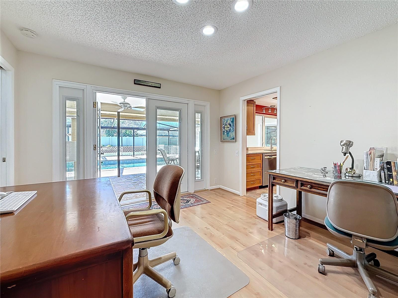 Dining room with French doors with built in shades