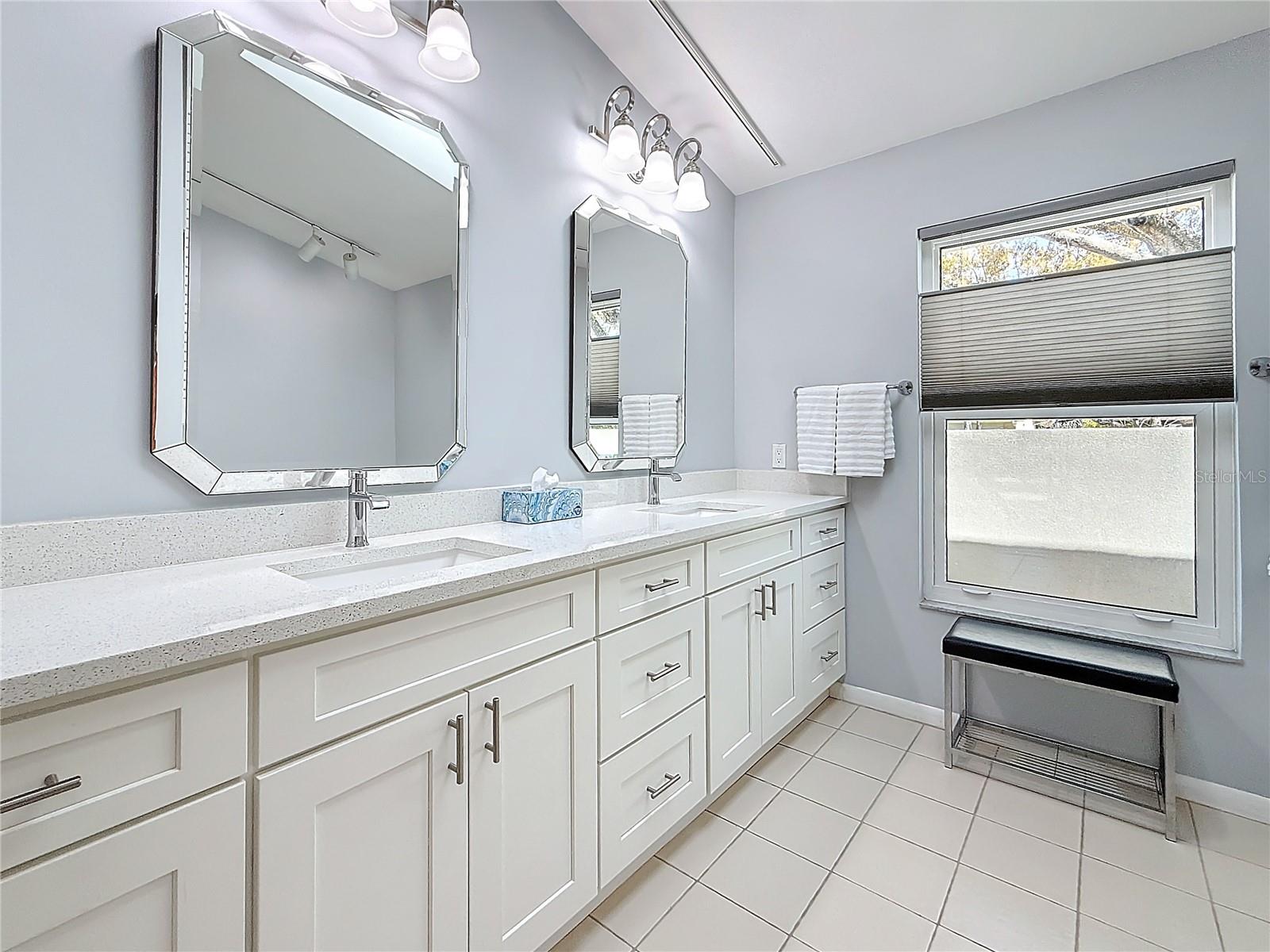 High profile vanity with double sinks and quartz countertops