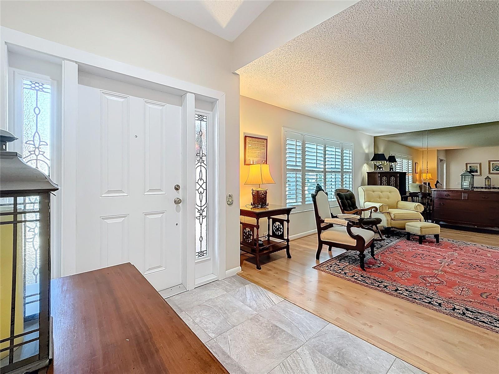 Spacious entryway open to the formal living room