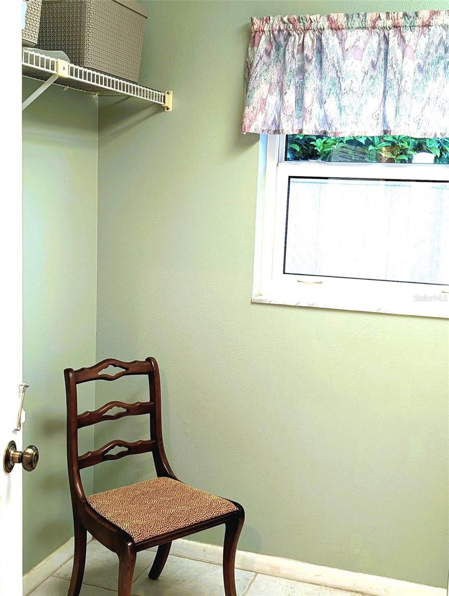 The other side of the laundry room is large enough for a second refrigerator