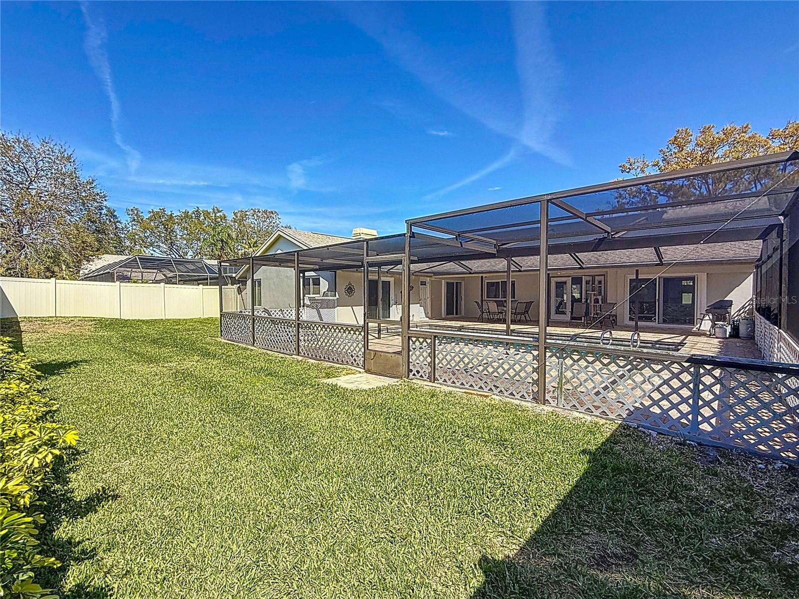 Fenced yard with new vinyl fencing