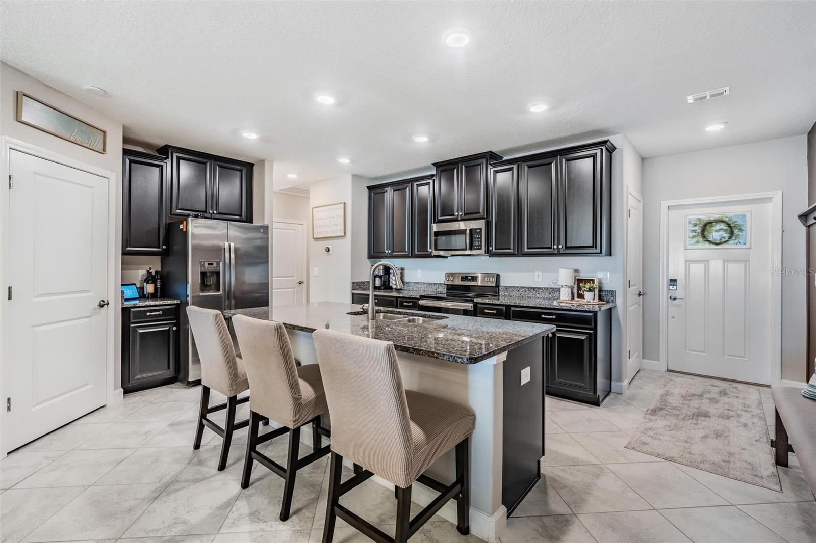 Beautiful espresso cabinets & stainless appliances