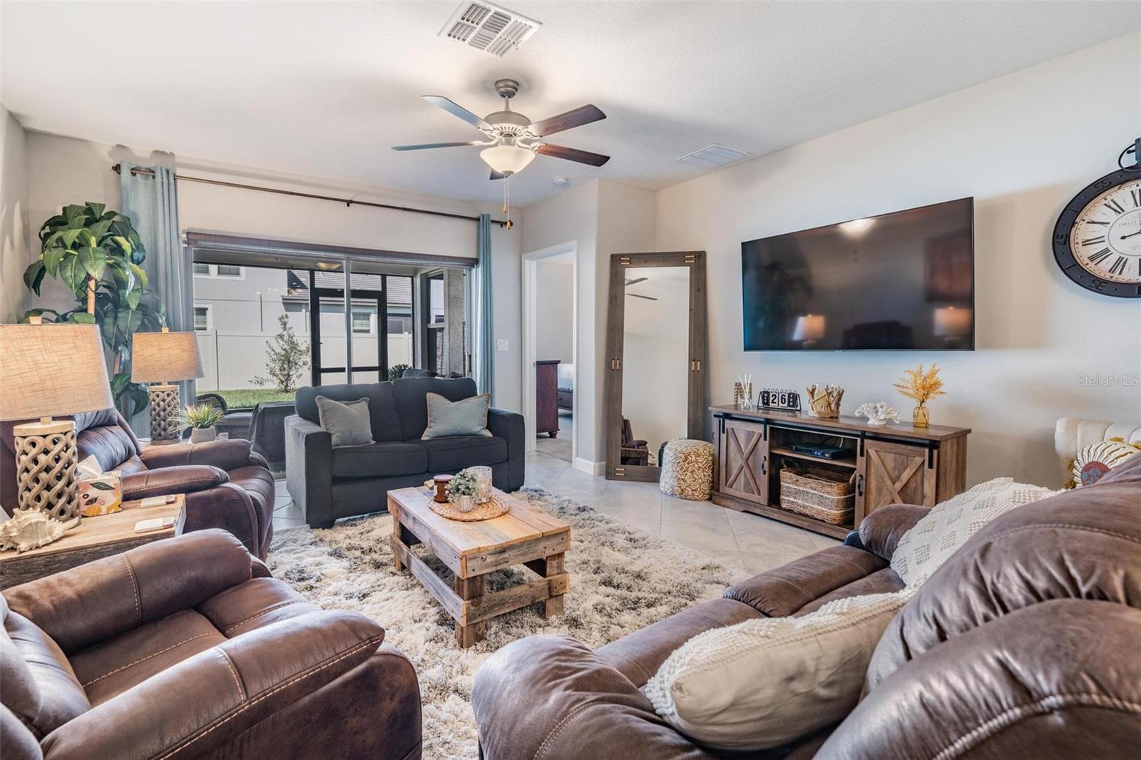 Spacious family room opens to screened lanai