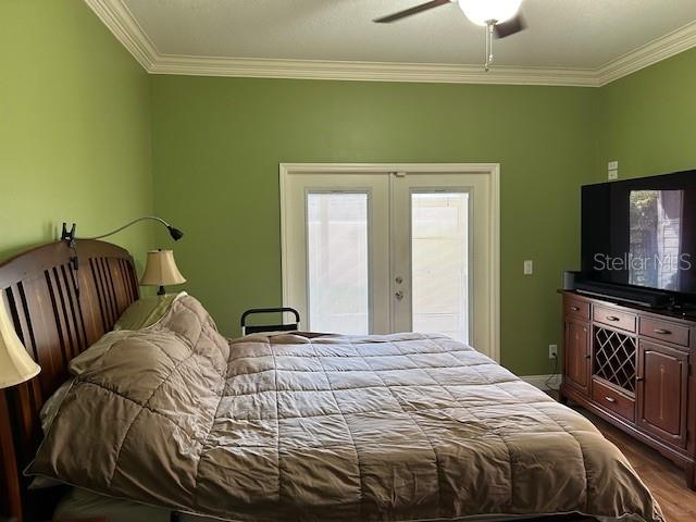 Master Bedroom with French doors leading to back porch,