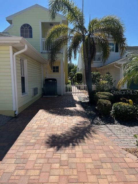 Private 1 car brick paver parking pad.