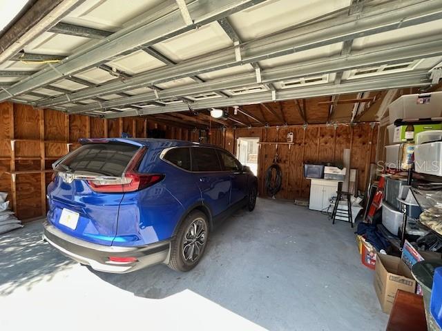 Oversize double car garage with alley access & parking pad.