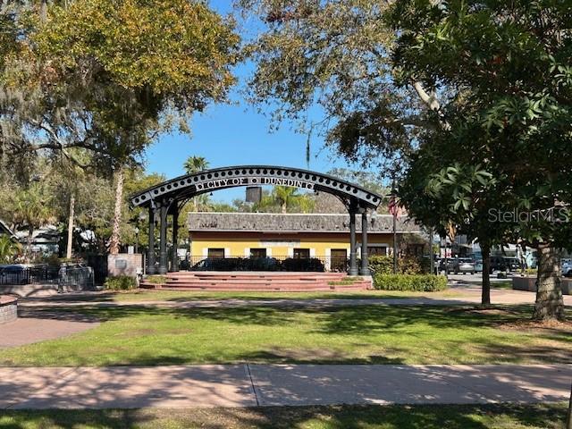 Downtown Dunedin park with entertainment stage.