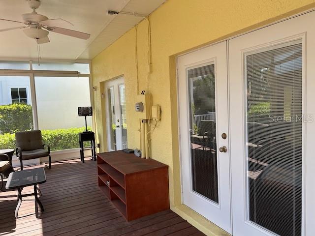 Screened back porch with double french Back porch with sun screens & double French doors into Family Room & Master Bedroom.