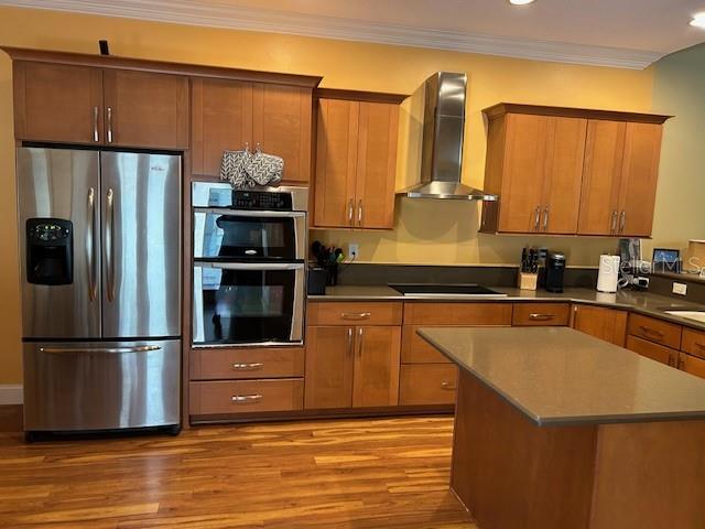 Renovated Kitchen featuring stainless steel appliances, upgraded cabinets/hardware & central island with storage cabinets.