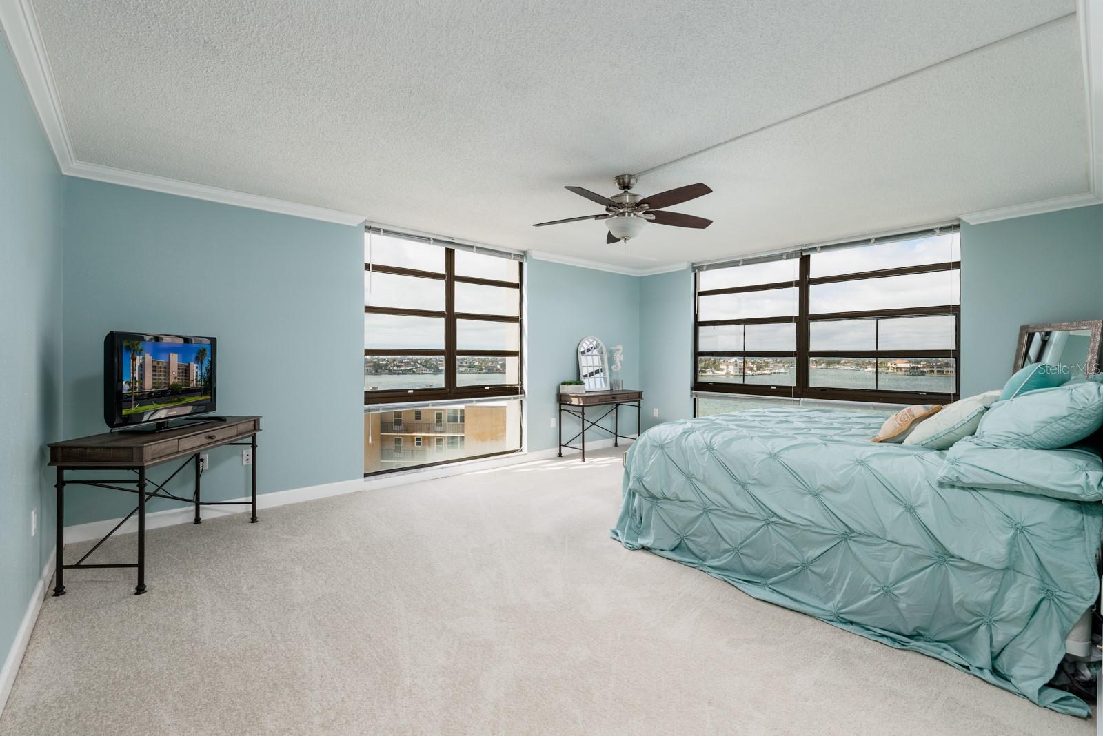 Oversized master suite with floor to ceiling windows providing spectacular views of Boca Ciega Bay, the intracoastal, peek a boo views of the Gulf & more!