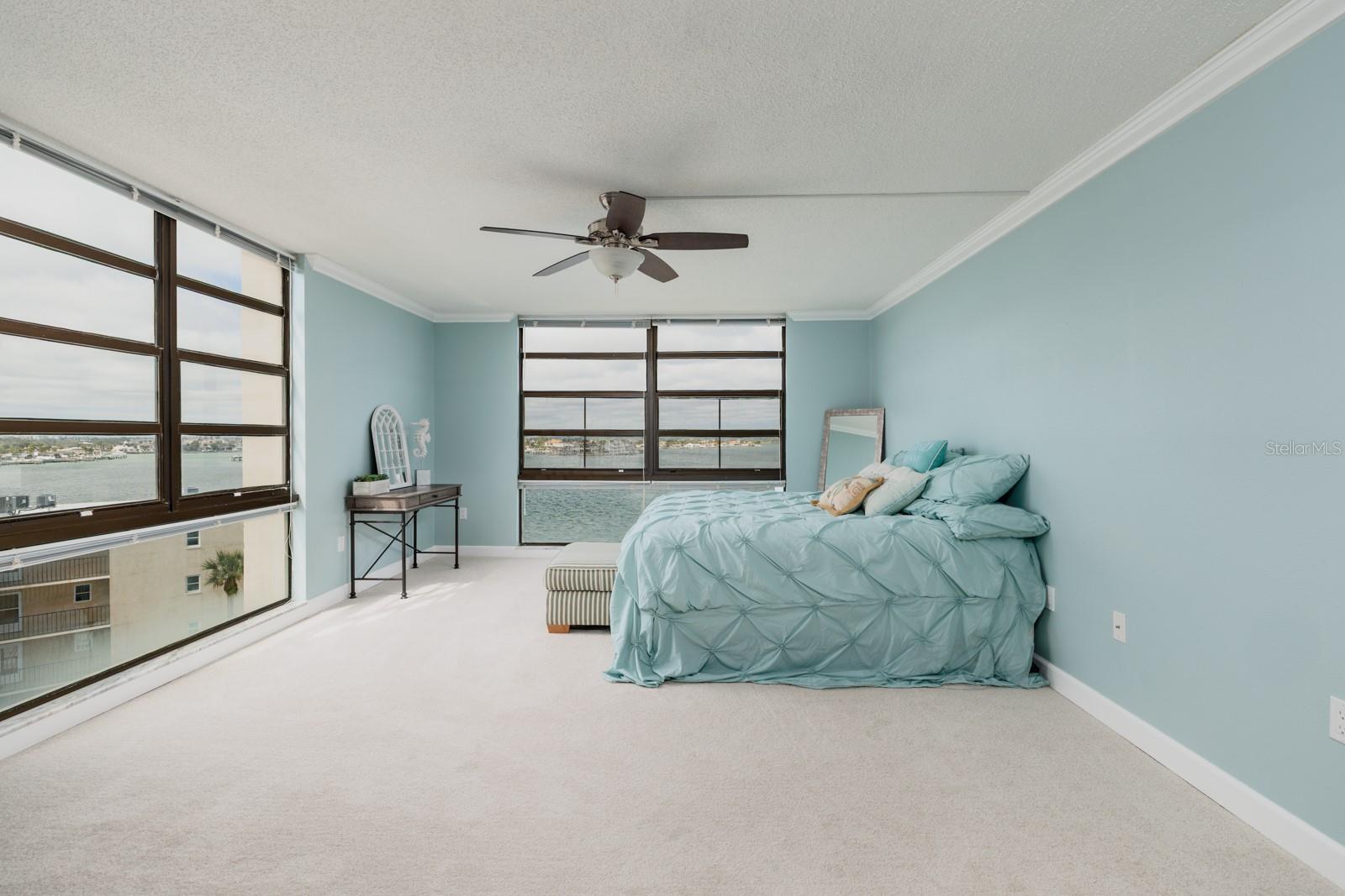 Oversized master suite with floor to ceiling windows providing spectacular views of Boca Ciega Bay, the intracoastal, peek a boo views of the Gulf & more!