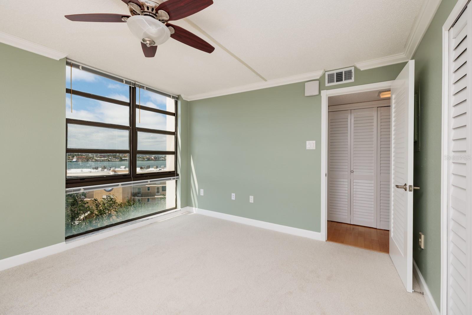 Second Bedroom with 2 oversize closets & floor  to ceiling windows with views of  the bay, the intracoastal, peek a boo view of the Gulf & more!