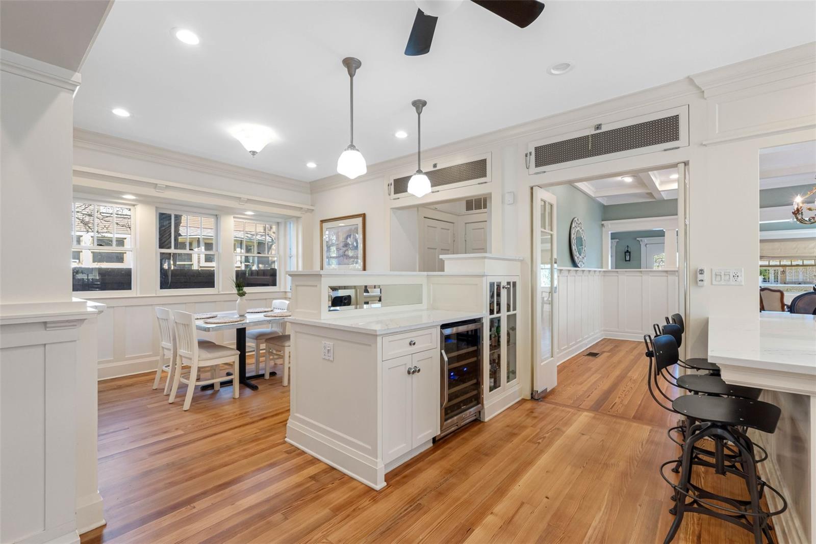 Looking from the family room: the eat-in breakfast area is on the left, the kitchen on the right and the dining room (followed by the living room) to the front.