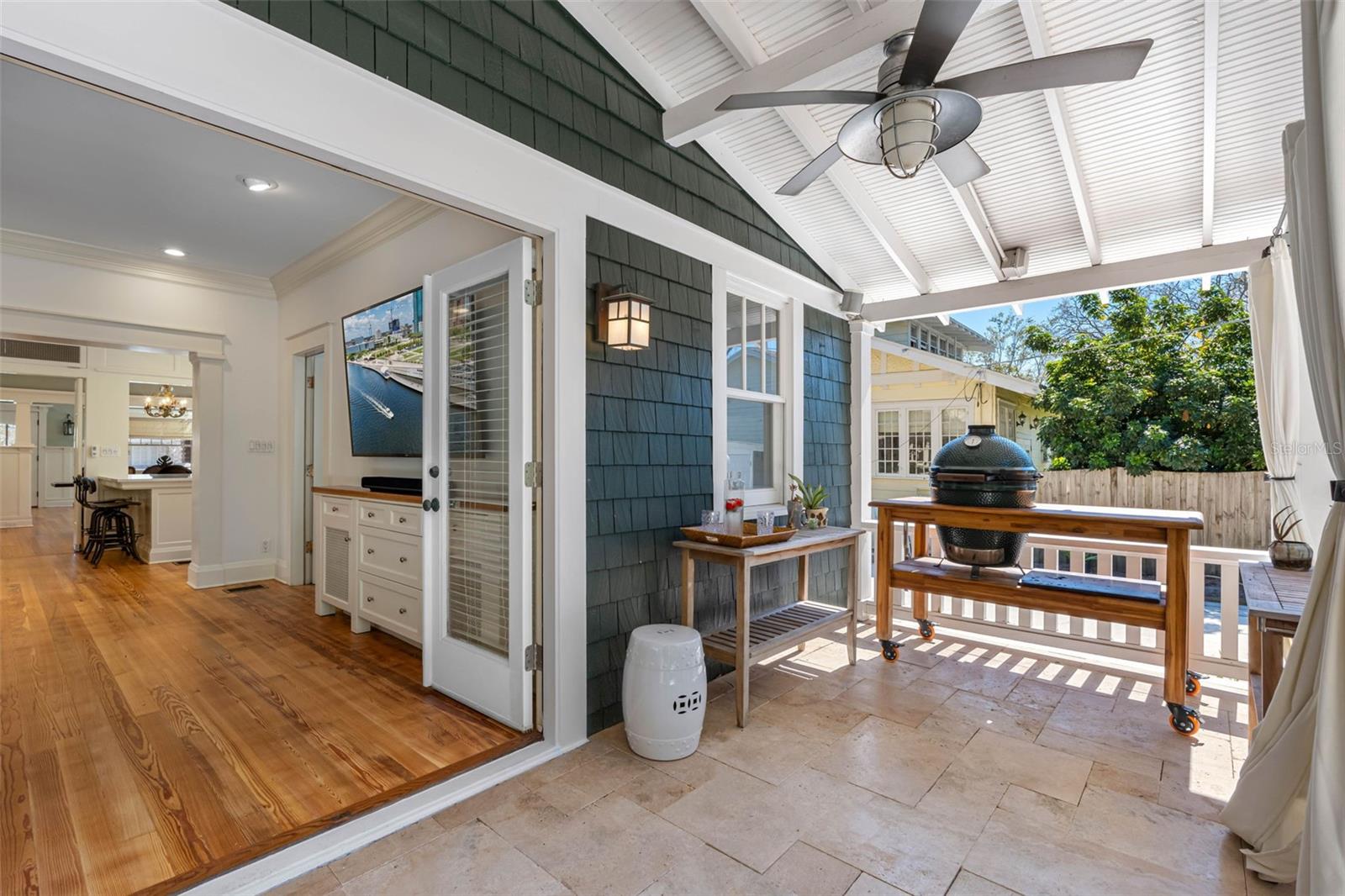 Back lanai with heated cocktail pool/spa and travertine pavers.