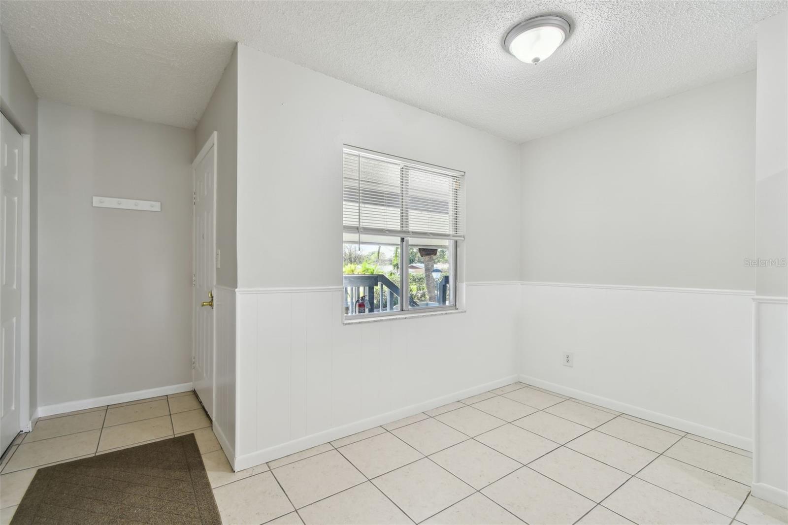 foyer with closet directly across from the front door.