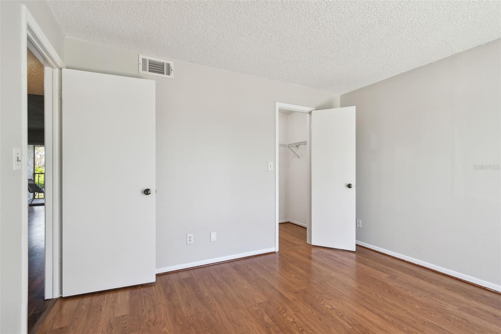 guest bedroom and walk-in closet