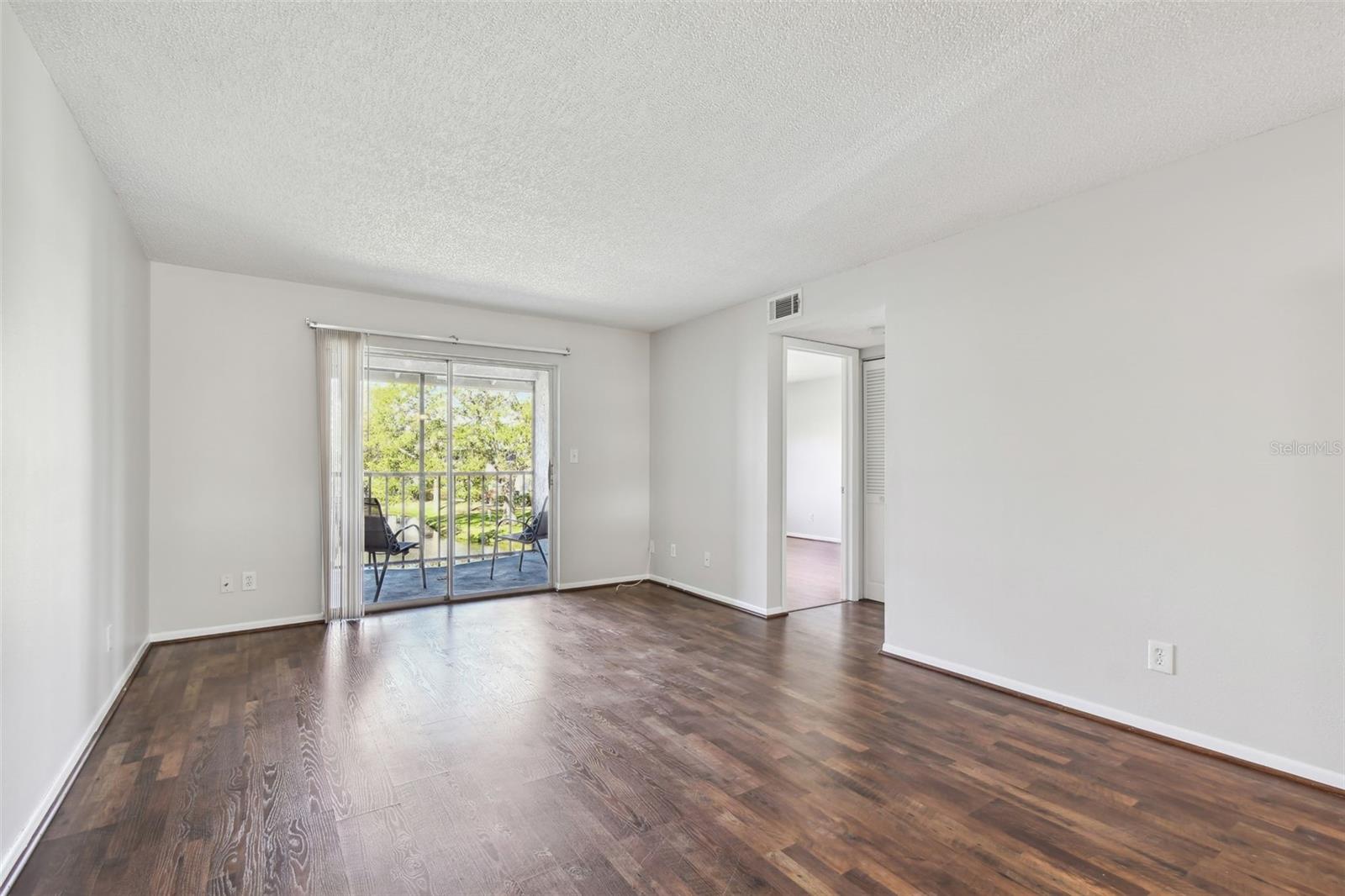 living room space with laminate flooring