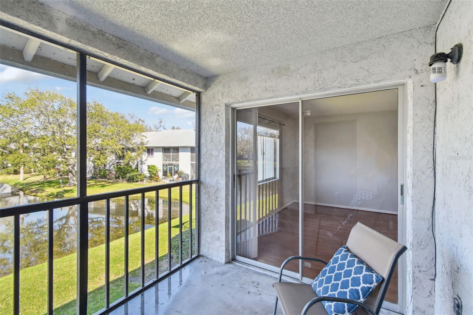 view into primary bedroom from balcony