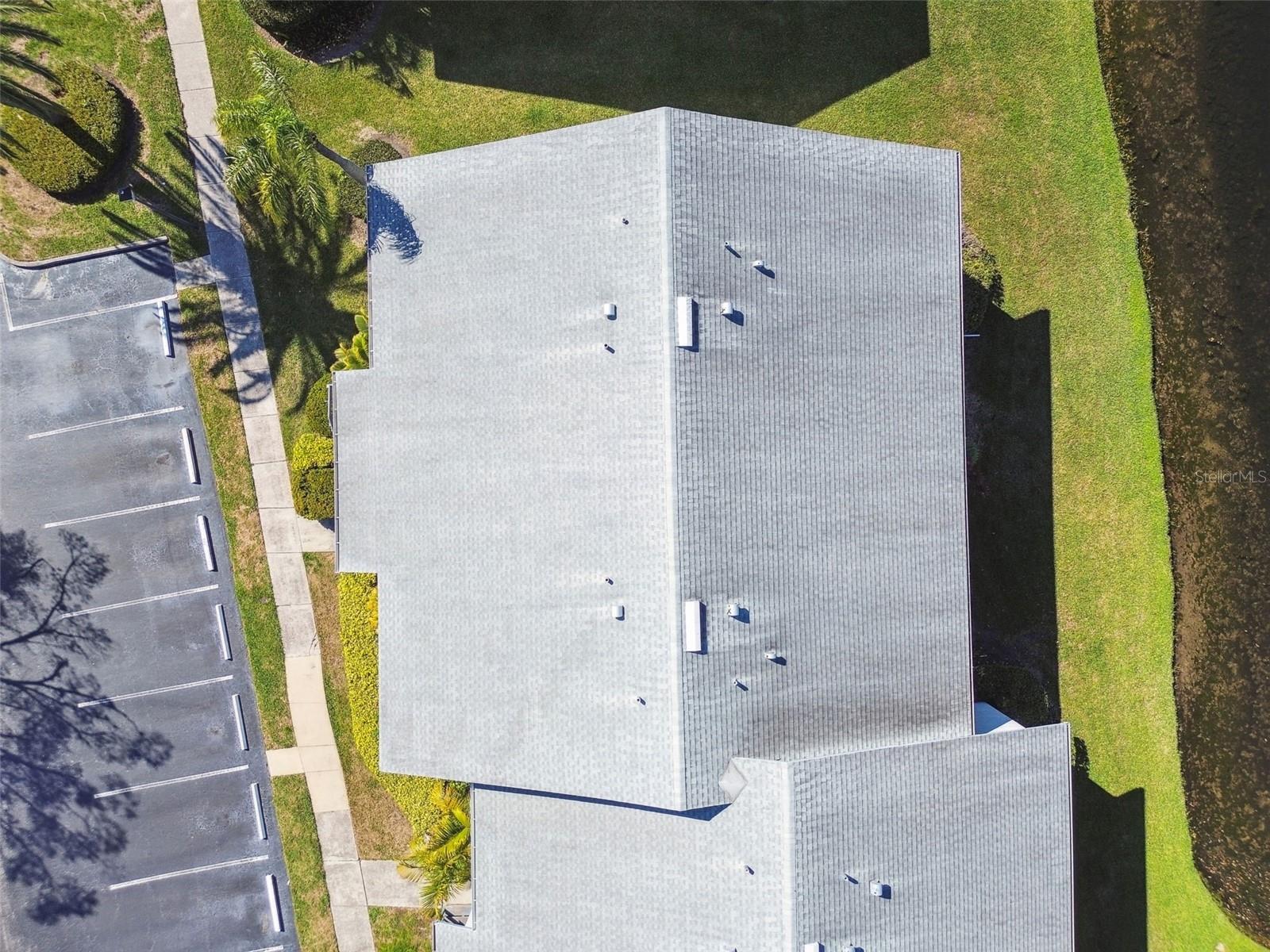 Unit is corner building: view of roof