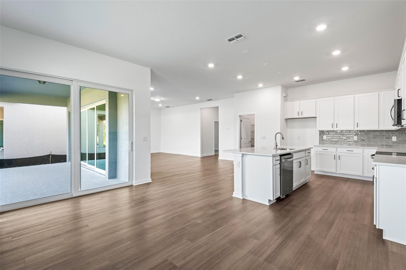 Dining room, kitchen, living area combination perfect for gatherings and celebrations