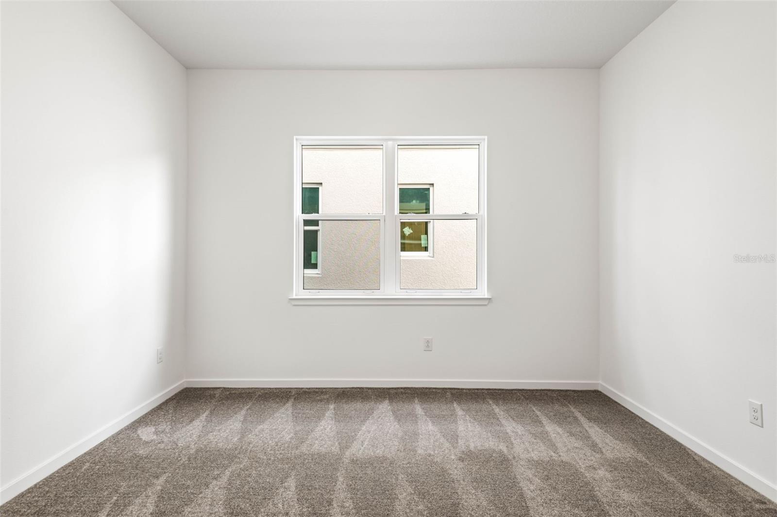 Flex space with double french doors. Perfect for a play room, office or craft room.