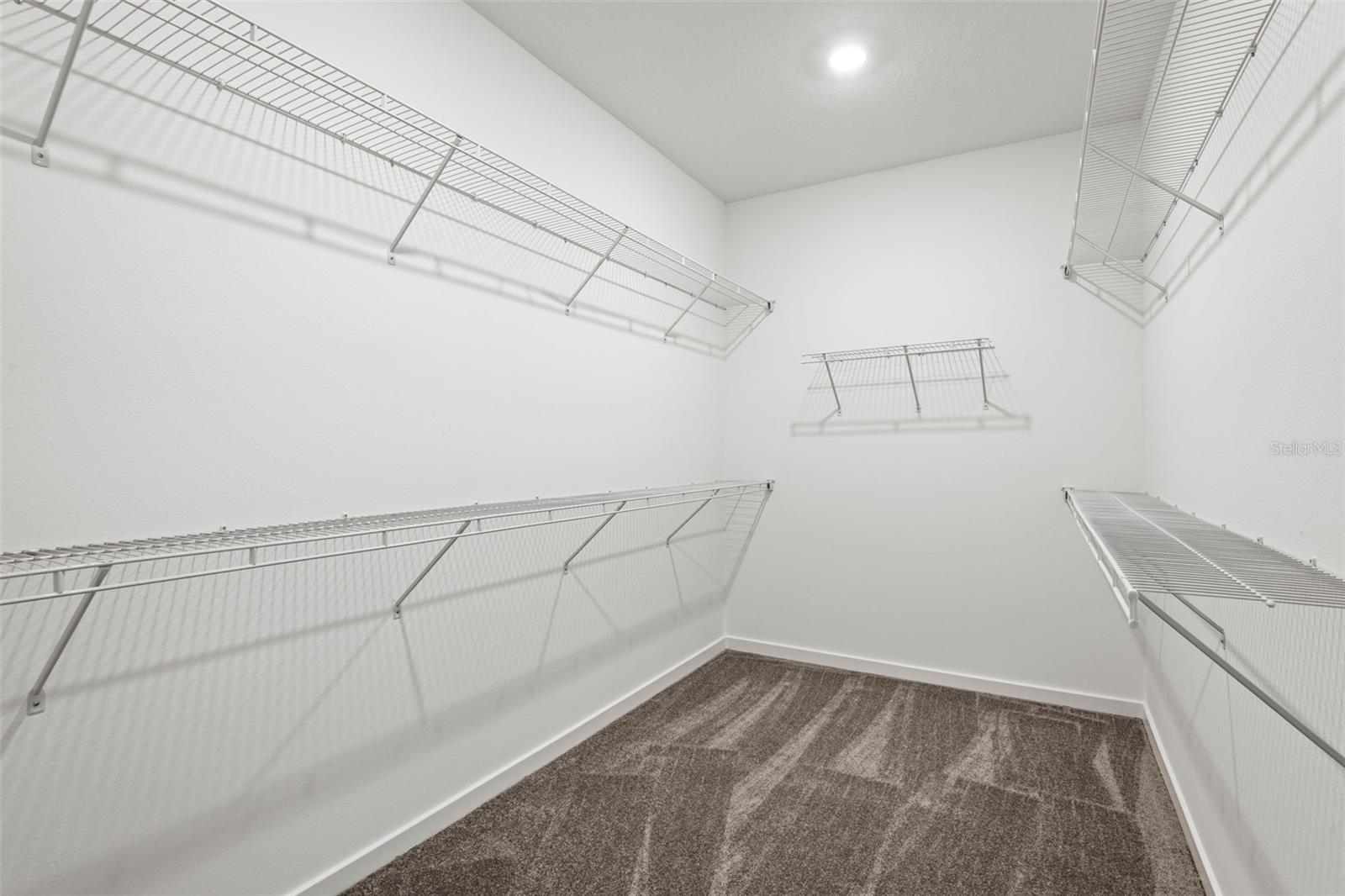 Primary bedroom en suite walk in closet
