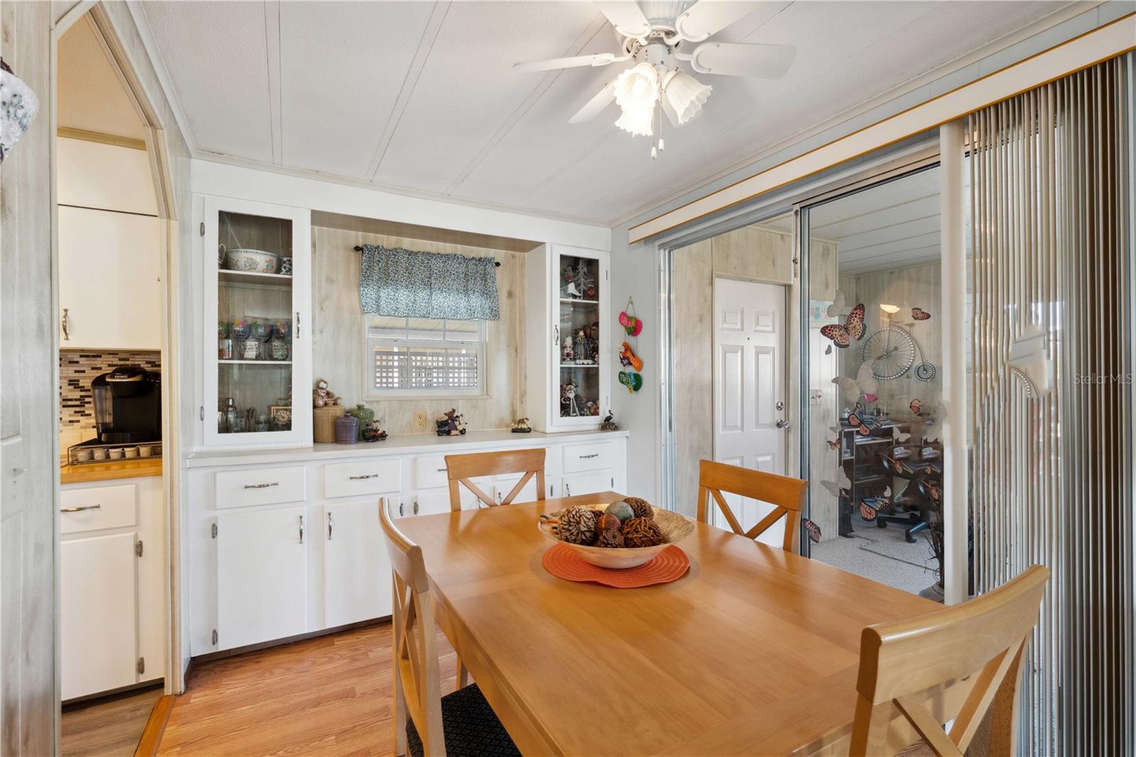 Dining area is off kitchen and open with living room.