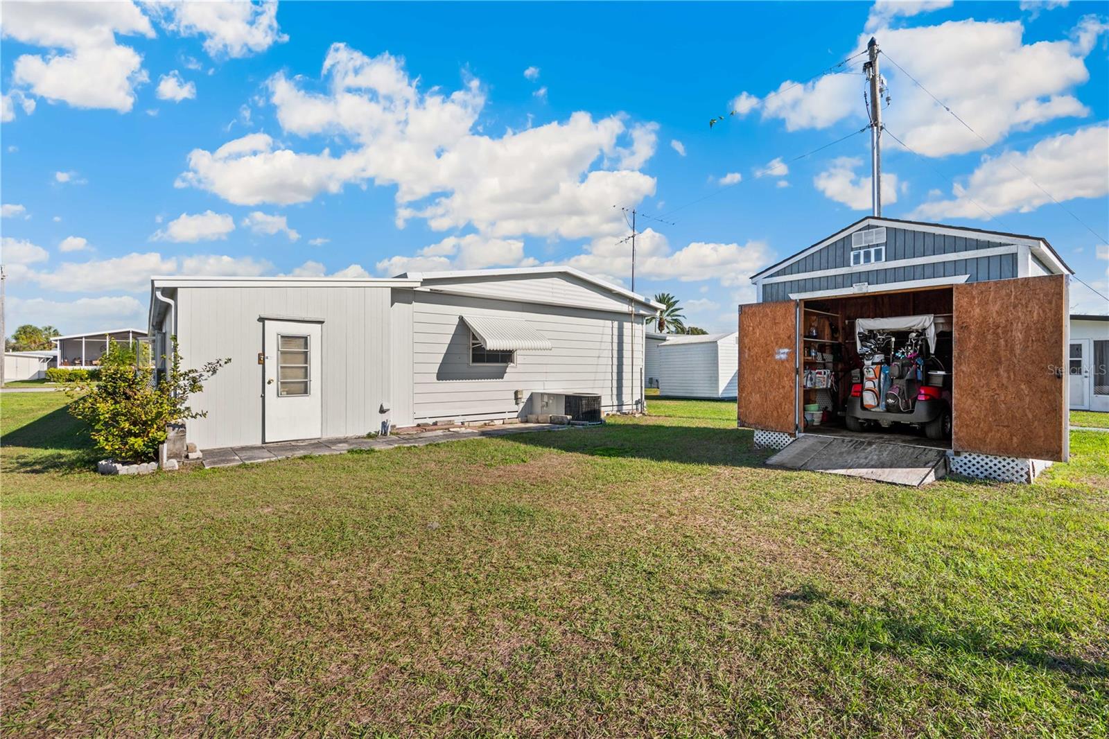 Detached storage shed for your golf cart.