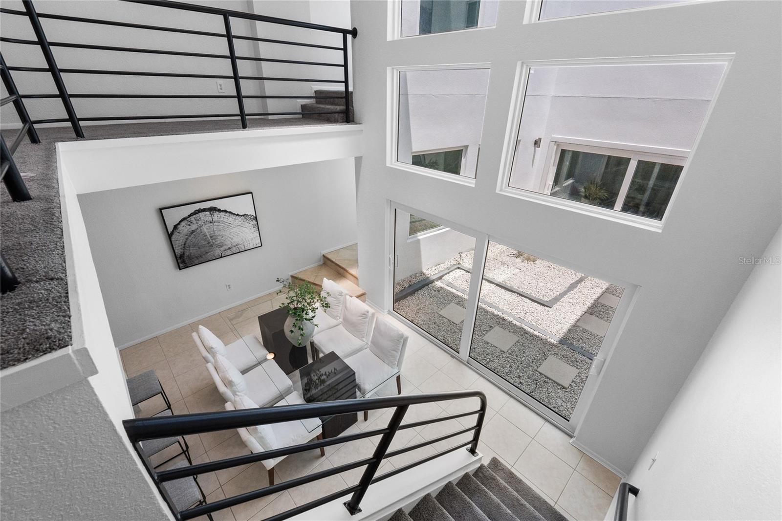 2nd Floor looking into atrium and down into dining room.