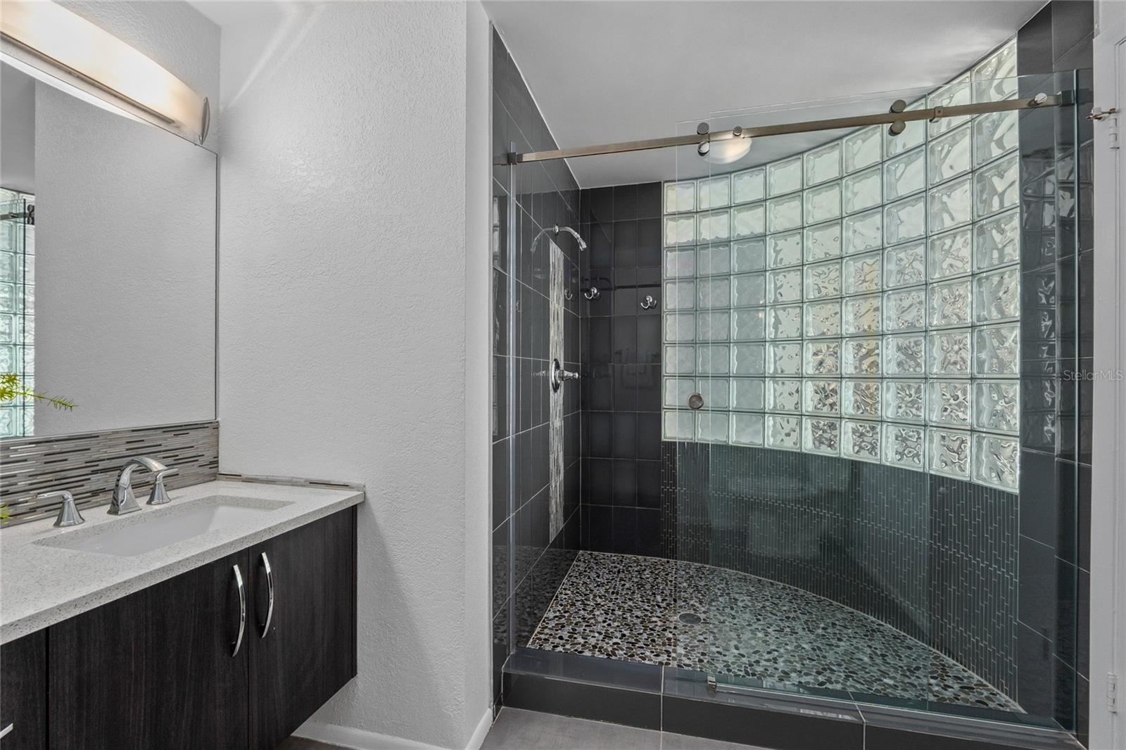 Primary bath with spacious shower.