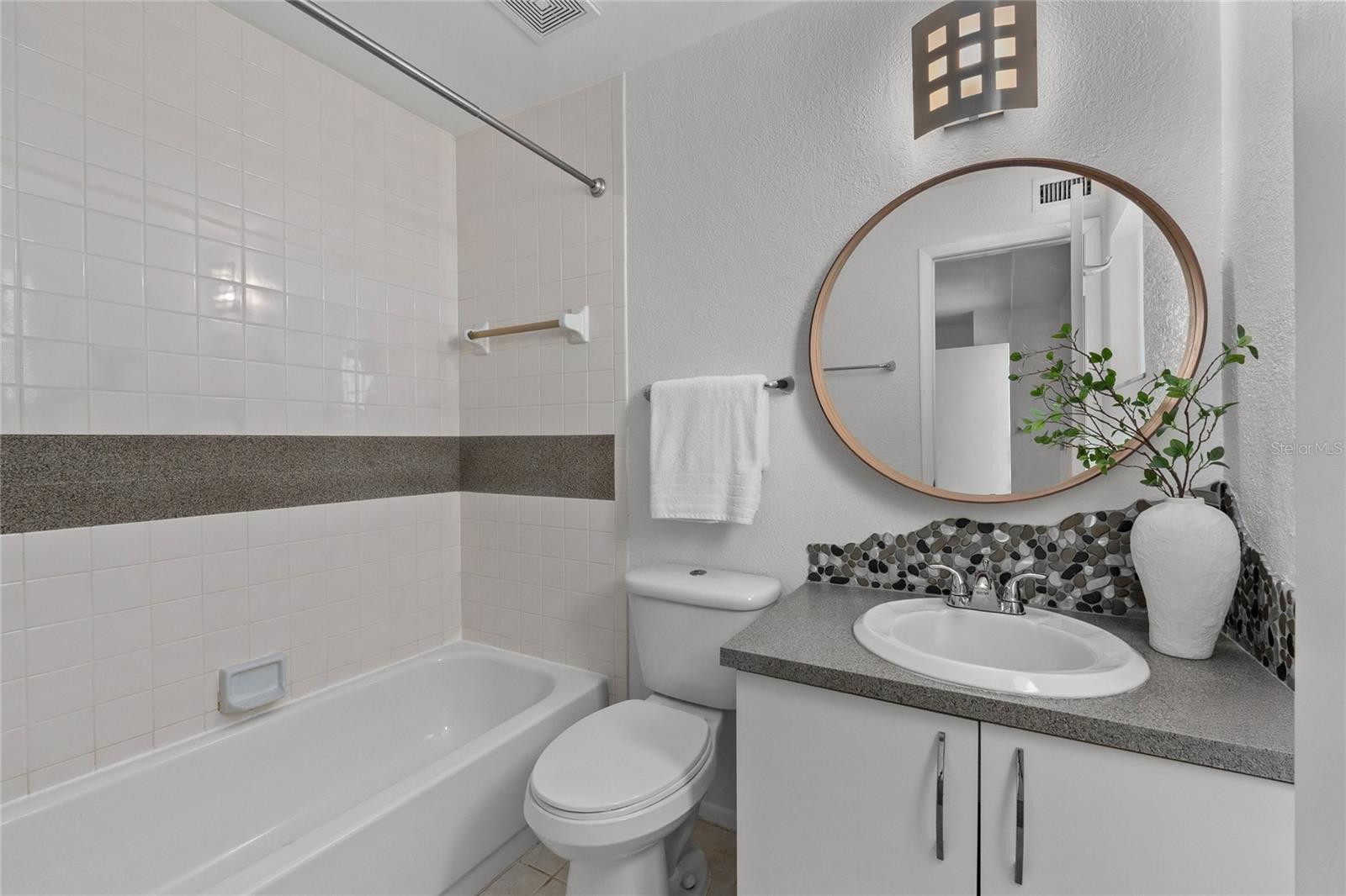 2nd Bedroom/ensuite bath with tub/shower combo.