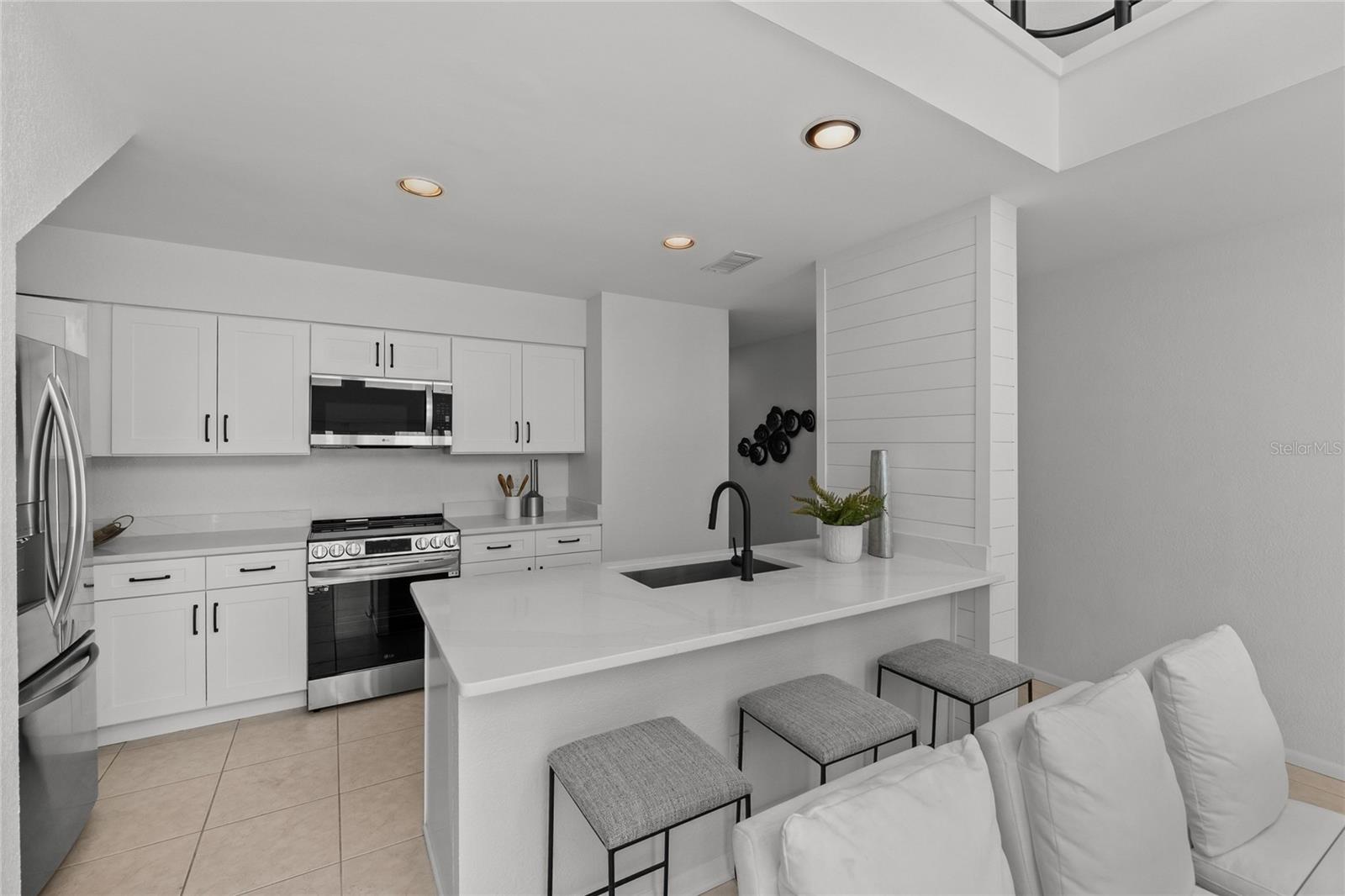 Beautiful Kitchen.  New cabinets, quartz counters and SS appliances.