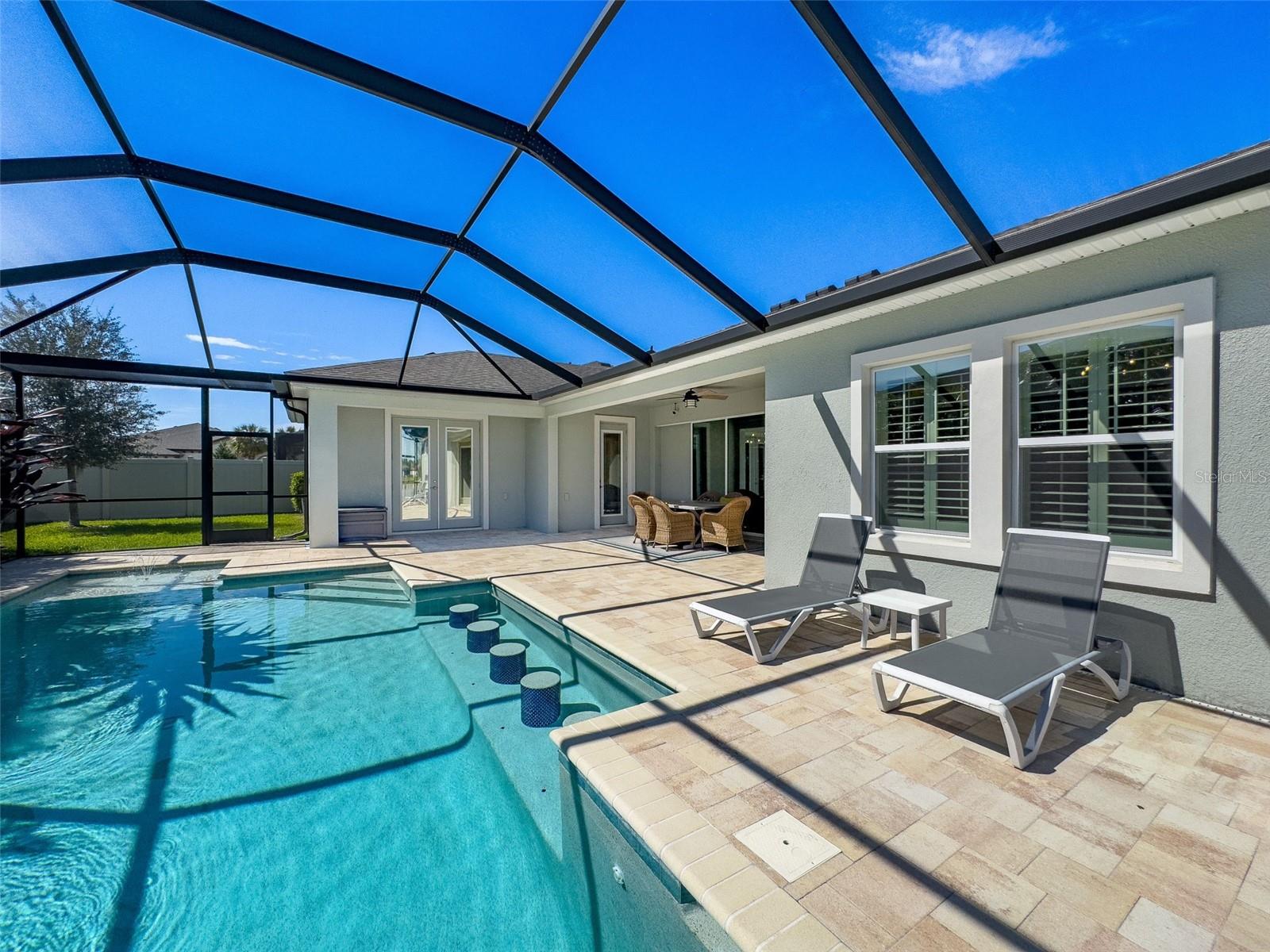 This custom pool and surroundings is just made for entertaining!