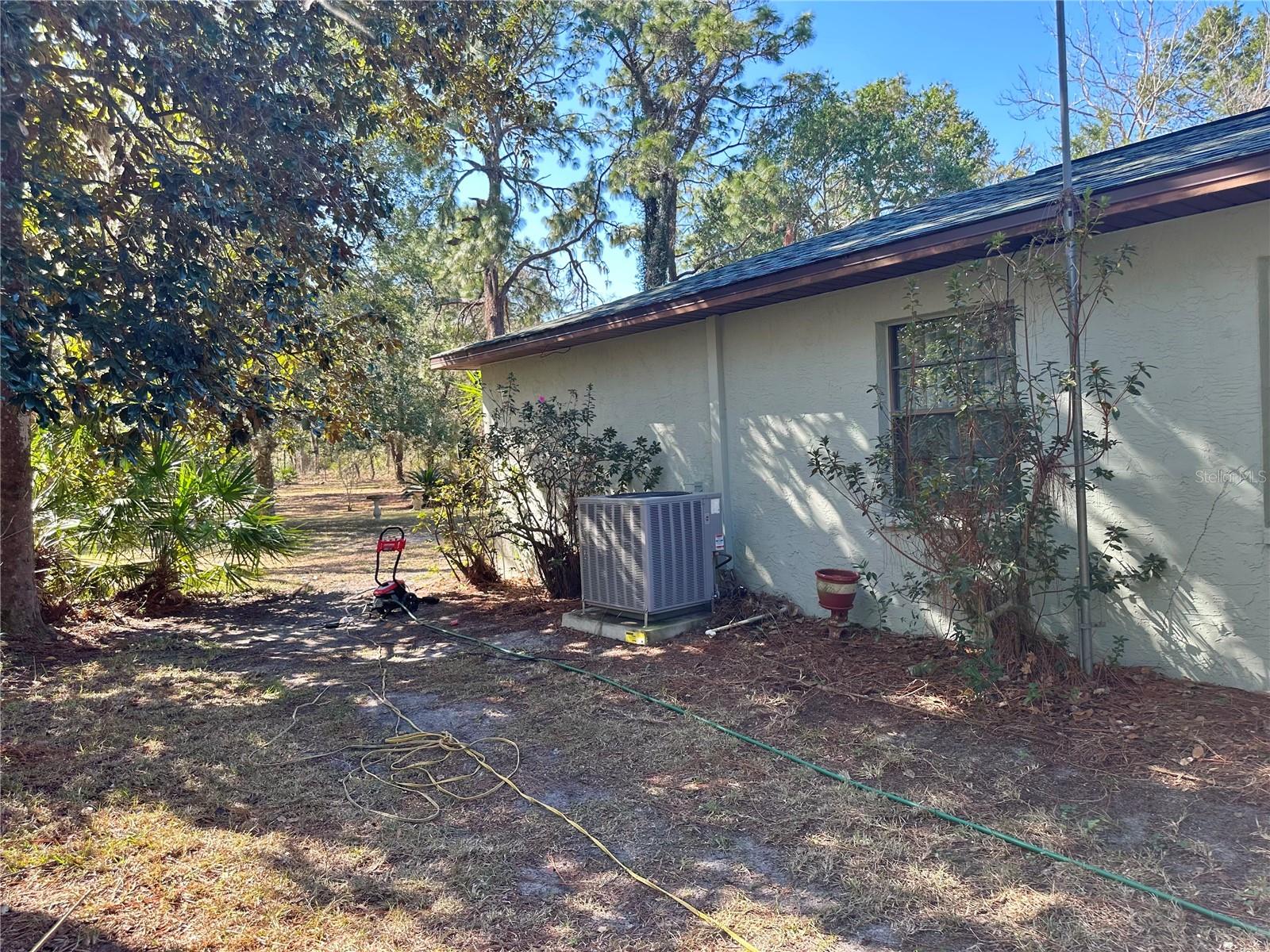 Side of home with newer A/C