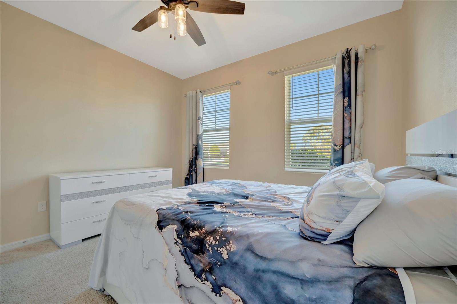 The second bedroom located at the front of the house., closer to the entrance door.