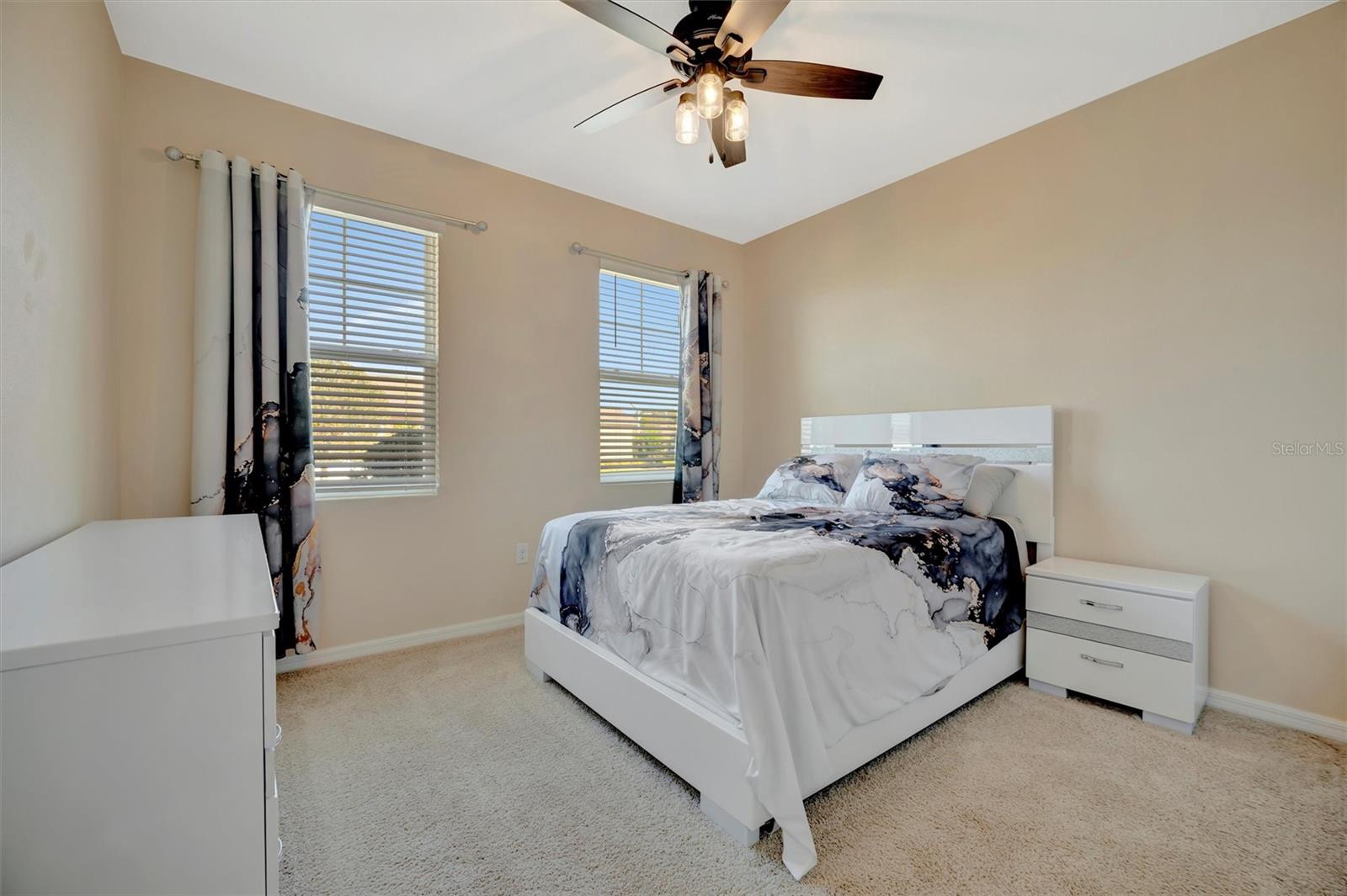 The second bedroom located at the front of the house., closer to the entrance door.