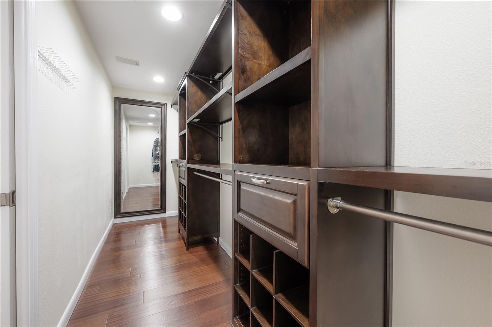 Primary bedroom walk in closet